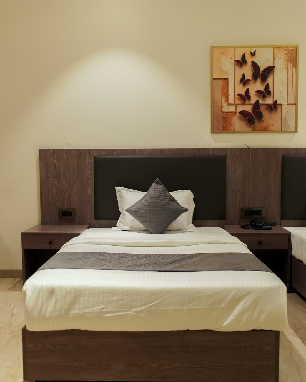 Twin bed room at The Zennith Suites